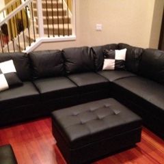 Black Leather Sectional Couch And Storage Ottoman