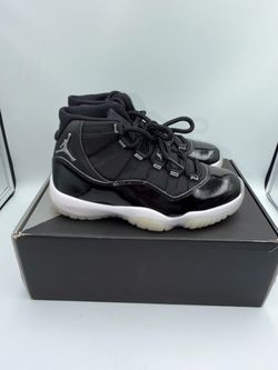 Air Jordan 11 Black Patent Leather Sneakers
