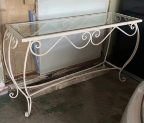 Heavy metal table with glass top $50