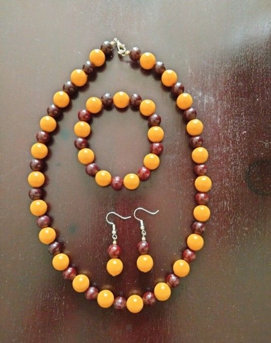 Set Of Necklace, earrings, And Bracelet.