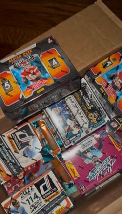Cover is screenshot from video - Unopened Football, Basketball and Baseball hobby mega and blaster boxes.