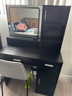 Black vanity with chair