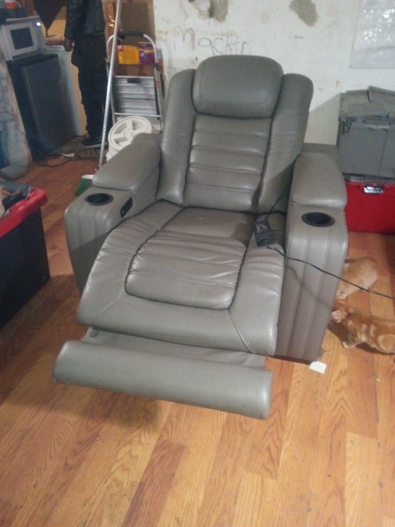 Orthopedic Leather Chair With Massage And Warm Adjustments Also A Phone Charger On It.