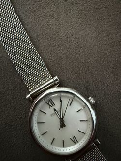 This a  silver watch for a female