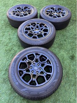 Ford F150 rims 265/60/18 like new tires