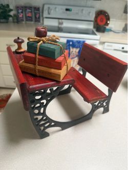 Miniature wooden school desk with separate school books