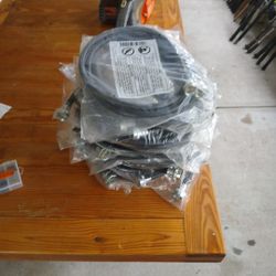 Wash machine hoses new and bag with washers