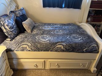 Full size bed with a pull-out trundle