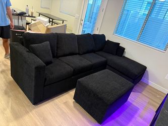 Brand new black sectionals with free ottoman