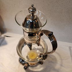 William Roger's 9 cup coffee or tea carafe in silver plate and glass with candle warmer.  Vintage charm and very functional.