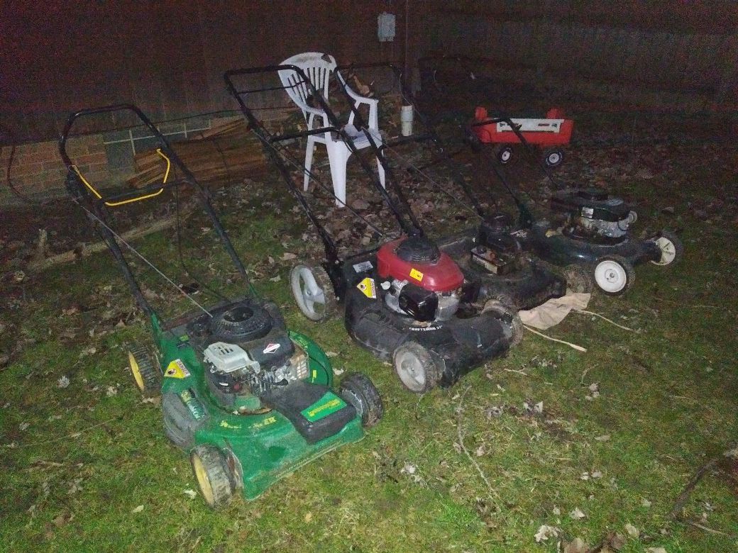 4 lawnmowers sold as is.