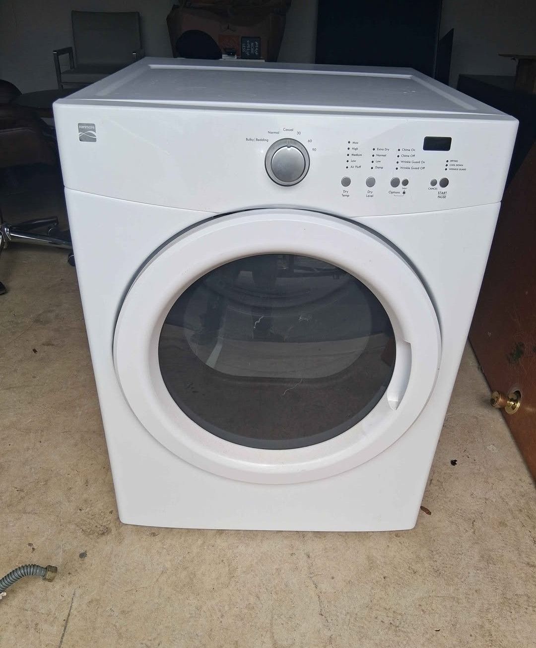 White Kenmore Front Load Elecric Dryer model # (contact info removed)2310 7.0 cu ft 35in H X 27in W X