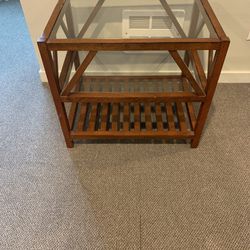 Three tier wooden side table with glass top. In good condition coming from a pet and smoke-free home. Asking only $30   Dimensions: length -19inch x w