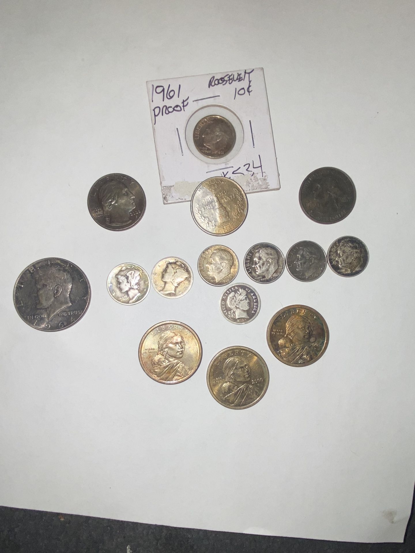 8 silver dimes a 1964 Kennedy and 3 Sacagawea coins with error and the rest quar