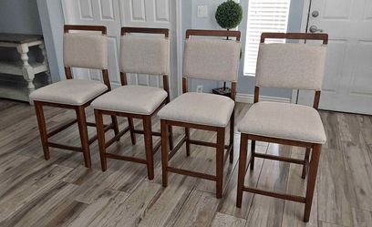 Four beautiful mid-century counter height barstools