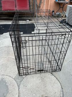 Extra-large metal animal cage measuring 30 inches high, 28 inches wide, and 41 inches long.