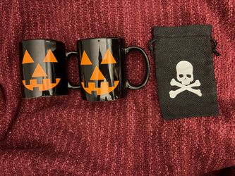 Two (2) Halloween coffee mugs with skull & bones small black gift bag