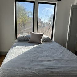 Queen bed and mattress. New.  Never used.