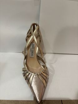 these are Jimmy Choo high heels in color, gold, and silver