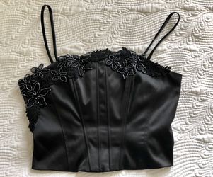 JS Collections corset top, black with beautiful detail decorations.
