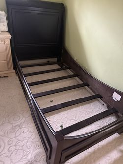 Ashley twin size bed with mattress.   Espresso finish