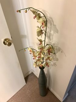 Metal vase with orchid