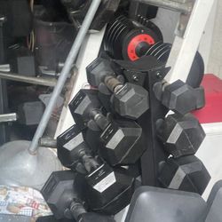 150 LBS.  OF NEW  RUBBER. DUMBBELLS  &  SMALL  DUMBBELL  RACK  (PAIRS OF)  :  25s  20s  15s  10s  5s 