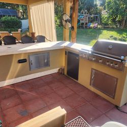 Outdoor Kitchen With Grill, Side Burner, Fridge And Sound System. 