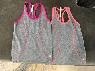 Set of 2 Ebb & Flow women’s athletic tank tops in heather gray with bright pink and coral accents!