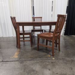 Brown Wood Dining Table and Four Chairs with Slatted Back Chairs