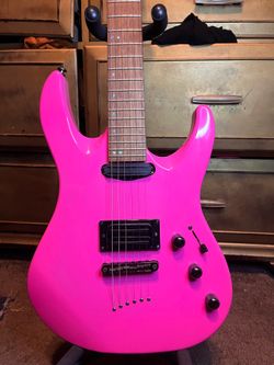 Mitchell pink guitar