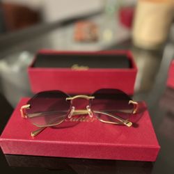 l:I Cartier gold and purple sunglasses