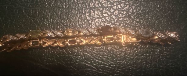 Gold bracelet with multicolored stones