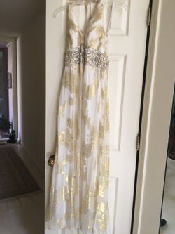 Sue Wong formal dress, size 2, worn once. Sleeveless Halter, w ties w beads, beautiful beading on front of dress. Dry cleaned, excellent condition.