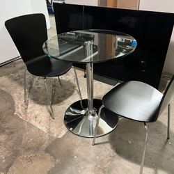 Cute, small table, and two chairs