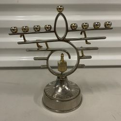 This is a vintage gold and silver plate  menorah