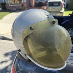 Vintage Buco gt helmet with metallic silver finish with bubnle shield