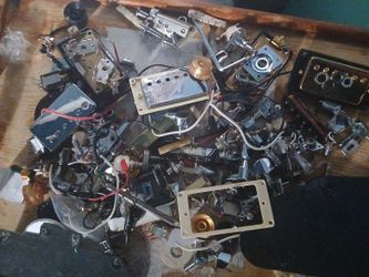 Lots\nOf lots of guitar parts pick ups , pots , tuners , kinds of stuff