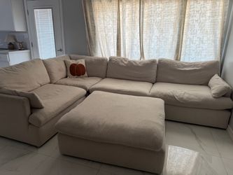 Sections cream colored sofa