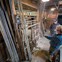 Scaffolding. Stand to building. Also, Suspension 