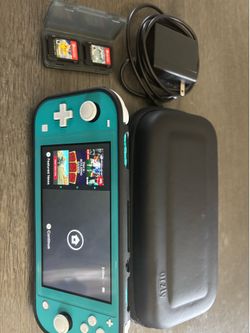Nintendo switch lite w/ 2 pokemon games