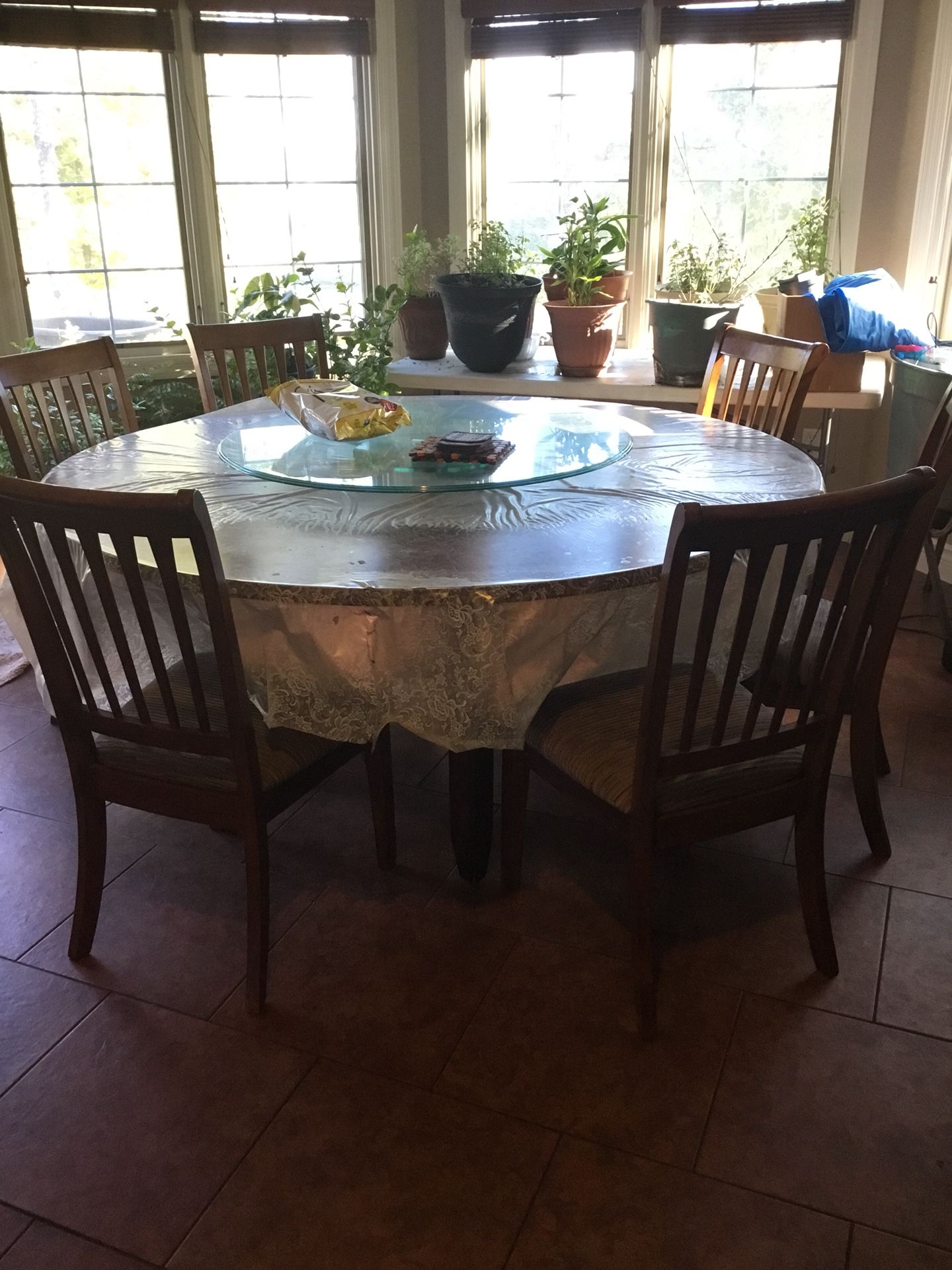 Round dining table with lazy Susan and matching chairs