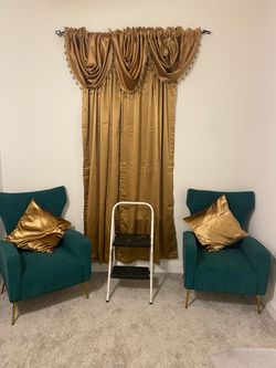 2 emerald green chairs