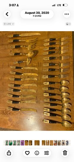 Vintage Siam Bronze Flatware Set, likely manufactured in Thailand during the 1960s or 1970s. The utensils feature brass or bronze heads with dark, dec
