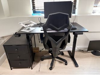 Desk and Monitor set up with chair and riser