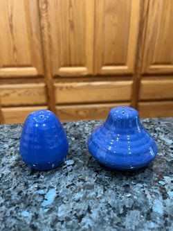 Vintage Blue Pottery Salt and Pepper Shakers.  Preowned the bottoms have some discoloration due to sitting in a cabinet for many years.  .  Has been o