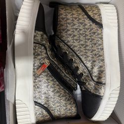 Michael Kors high-top trainers featuring a metallic gold MK