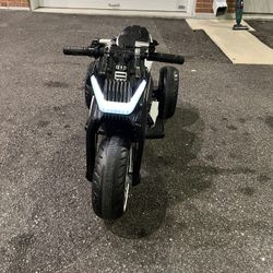 Tobbi 12V Kids Ride Battery Powered Dirt Motorcycle w/ 3 Wheels with charger. Pre owned very gently used in excellent and fully functional. Pick up lo