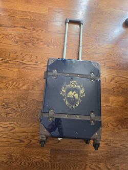 Harry Potter Ravenclaw Hard-Sided 21" Carry-on Spinner Luggage. Blue