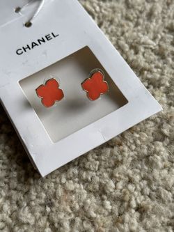 Orange enamel clover/quatrefoil studs — silver-tone (unbranded)